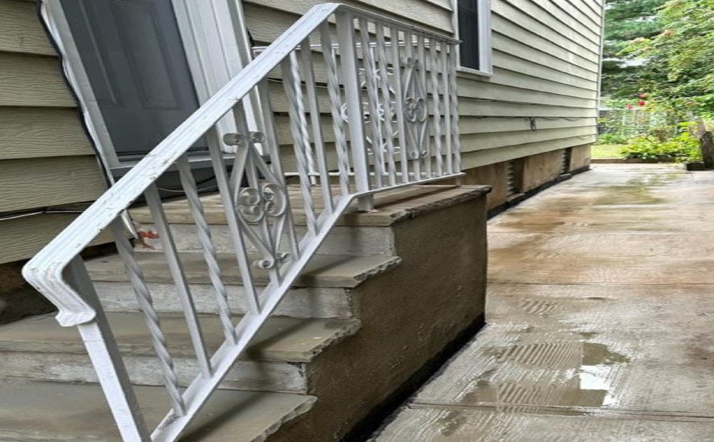 The same concrete steps and walkway after cleaning by Property Washing Pros